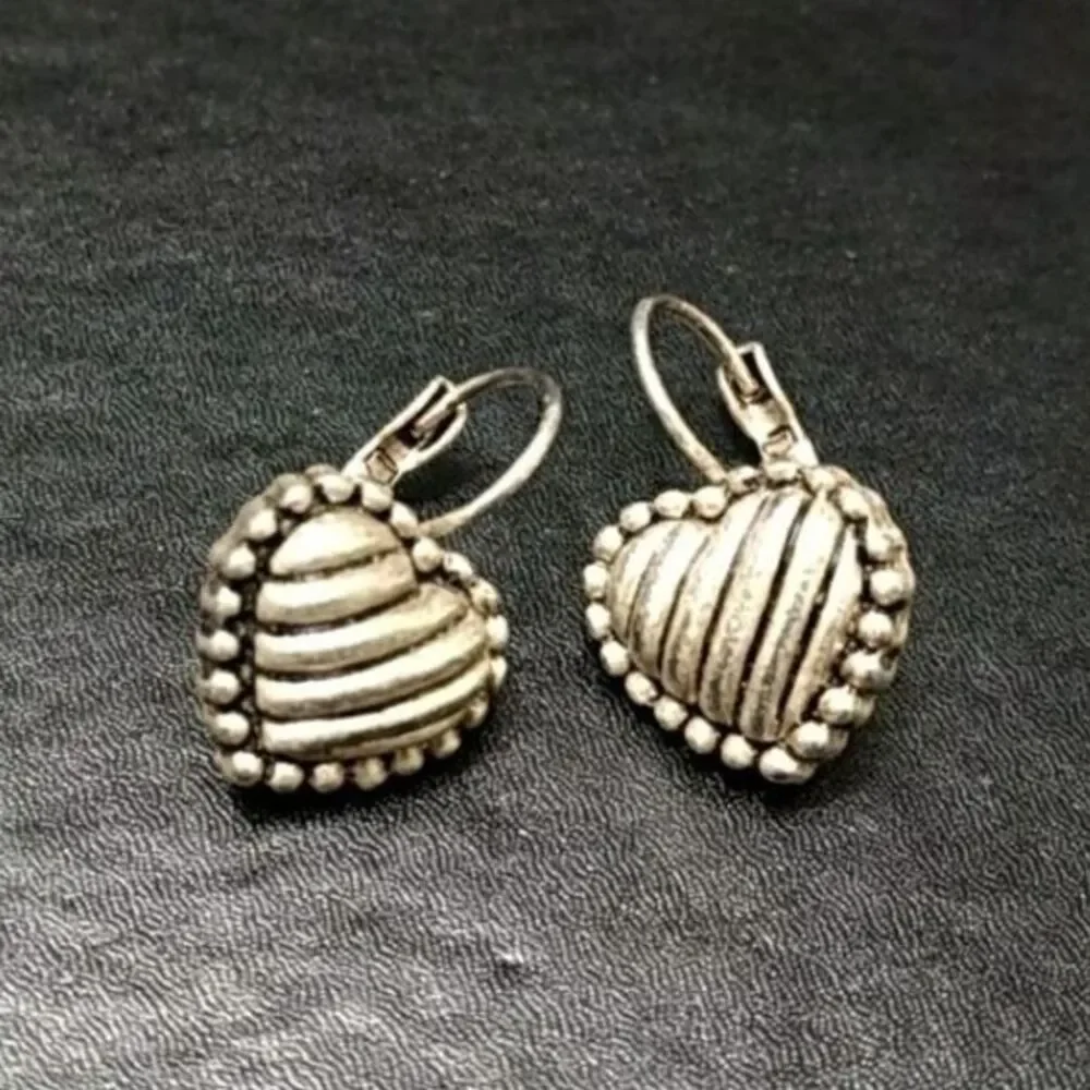 Silver tone heart earrings textured dangling